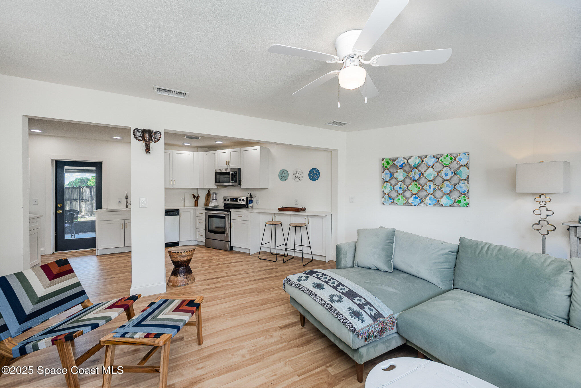 233 Beverly Road Cocoa, FL 32922 - Photo 4 of 20 a living room with furniture and kitchen view