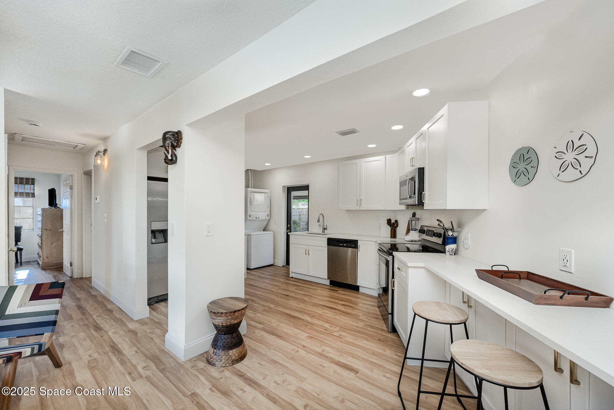 233 Beverly Road Cocoa, FL 32922 - Photo 6 of 20 a kitchen with a table and chairs in it