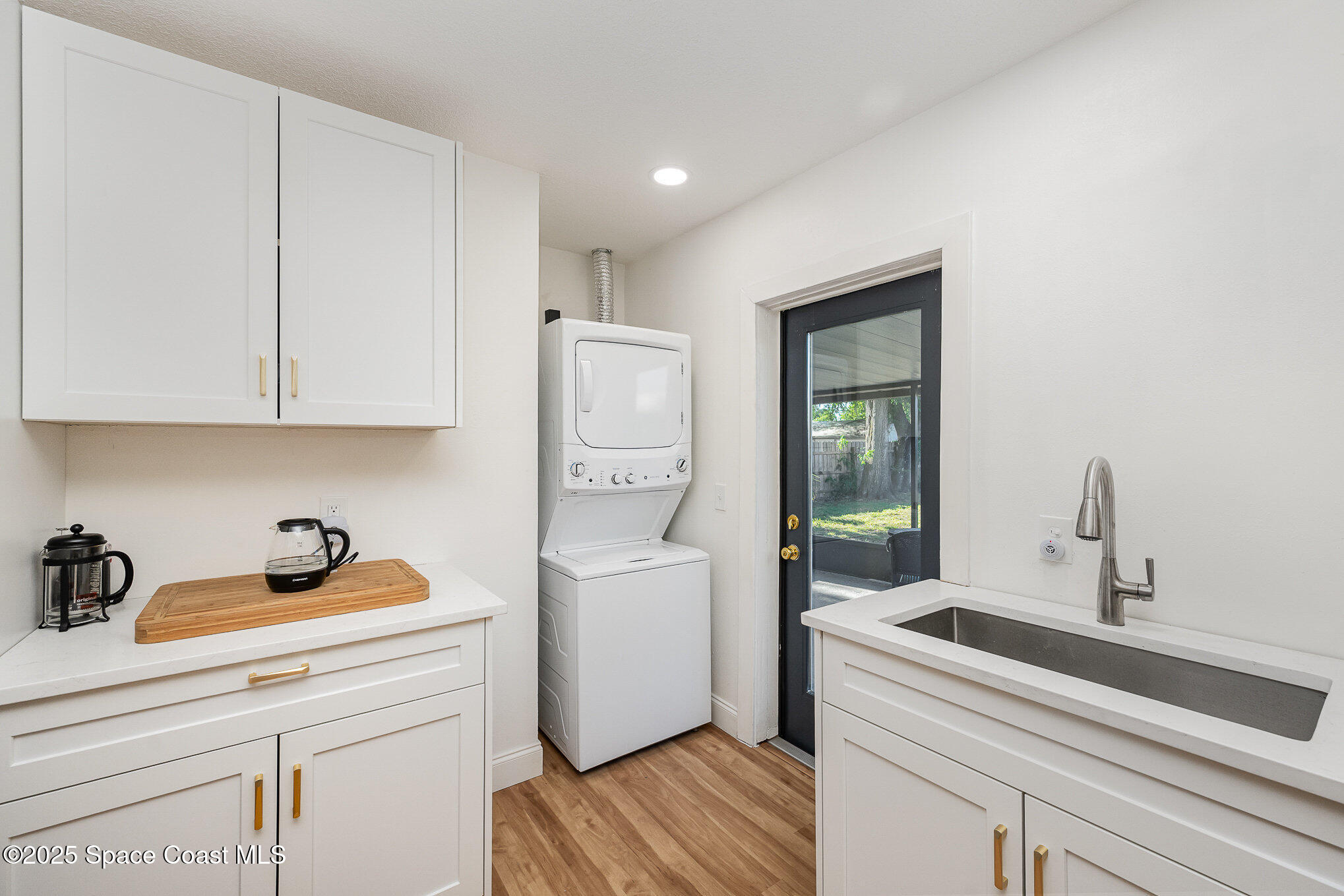 233 Beverly Road Cocoa, FL 32922 - Photo 10 of 20 a room with a sink and cabinets