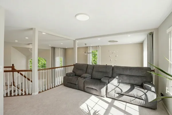 a living room with furniture and white walls