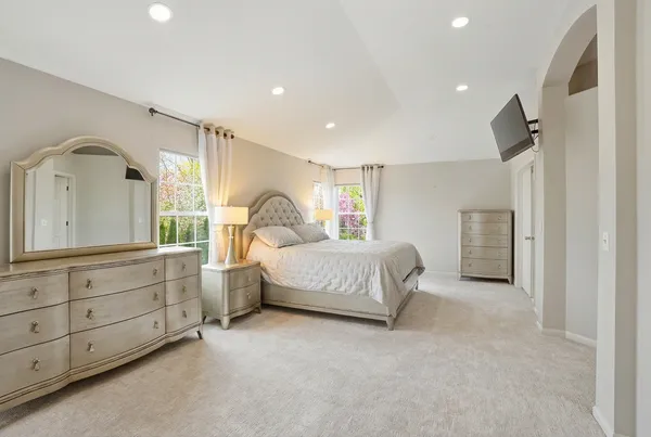 a bedroom with bed and window