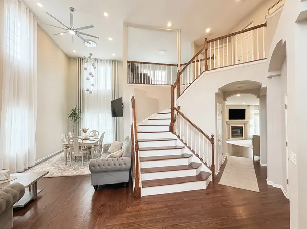 a view of entryway and hall with wooden floor