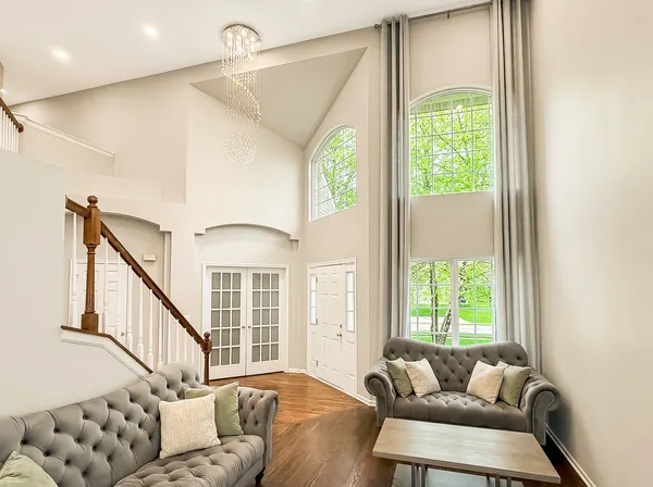 a living room with furniture and a large window