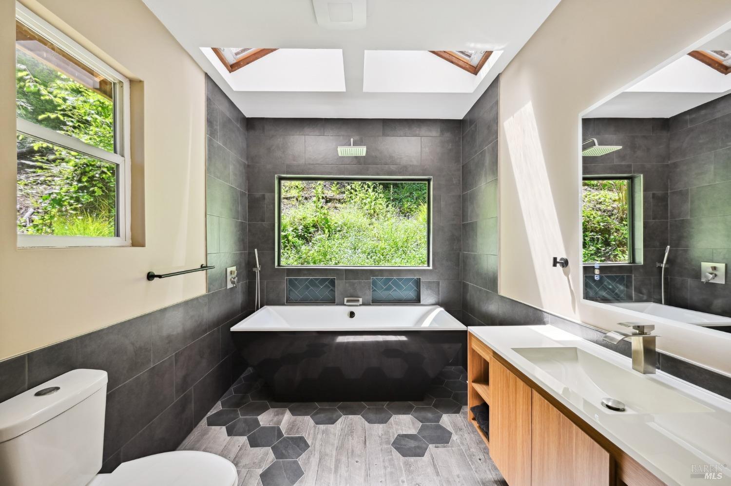 21713 Starrett Hill Drive Monte Rio, CA 95462 - Photo 11 of 50 a bathroom with a large tub sink and window