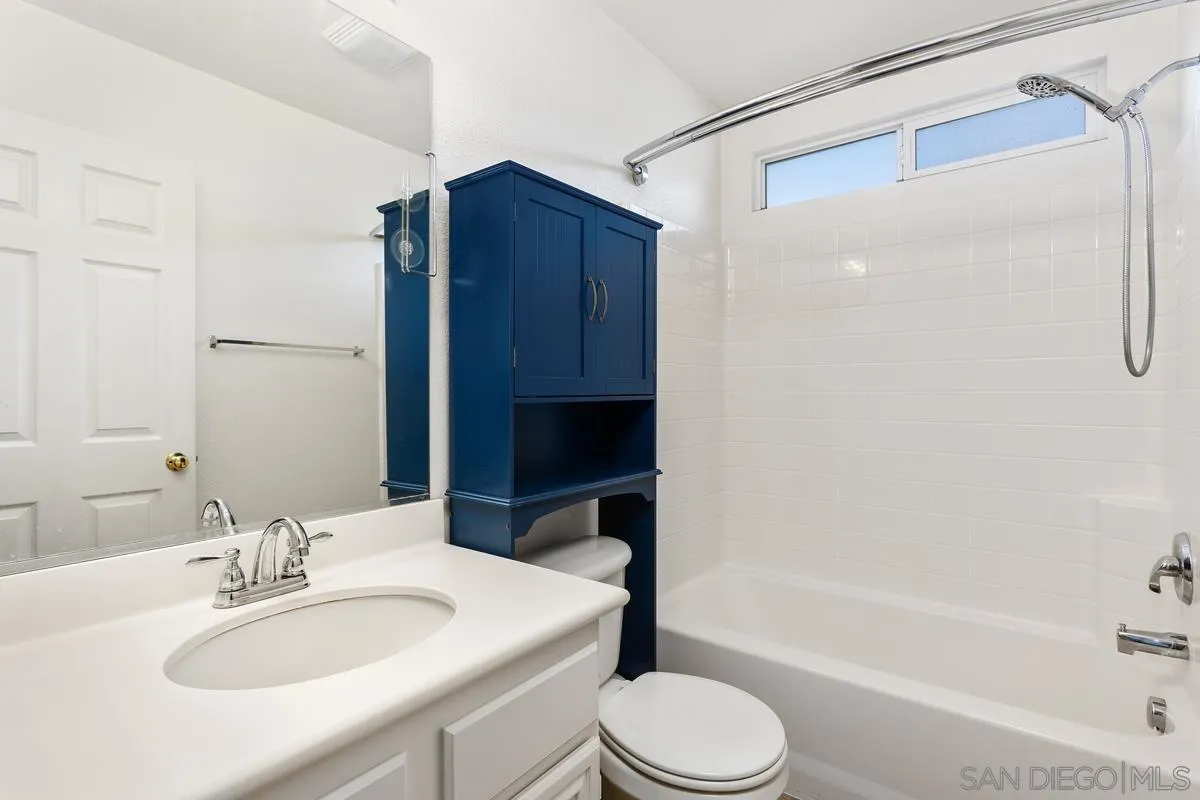 5145 Mendip Street Oceanside, CA 92057 - Photo 15 of 33 a bathroom with a sink toilet and shower