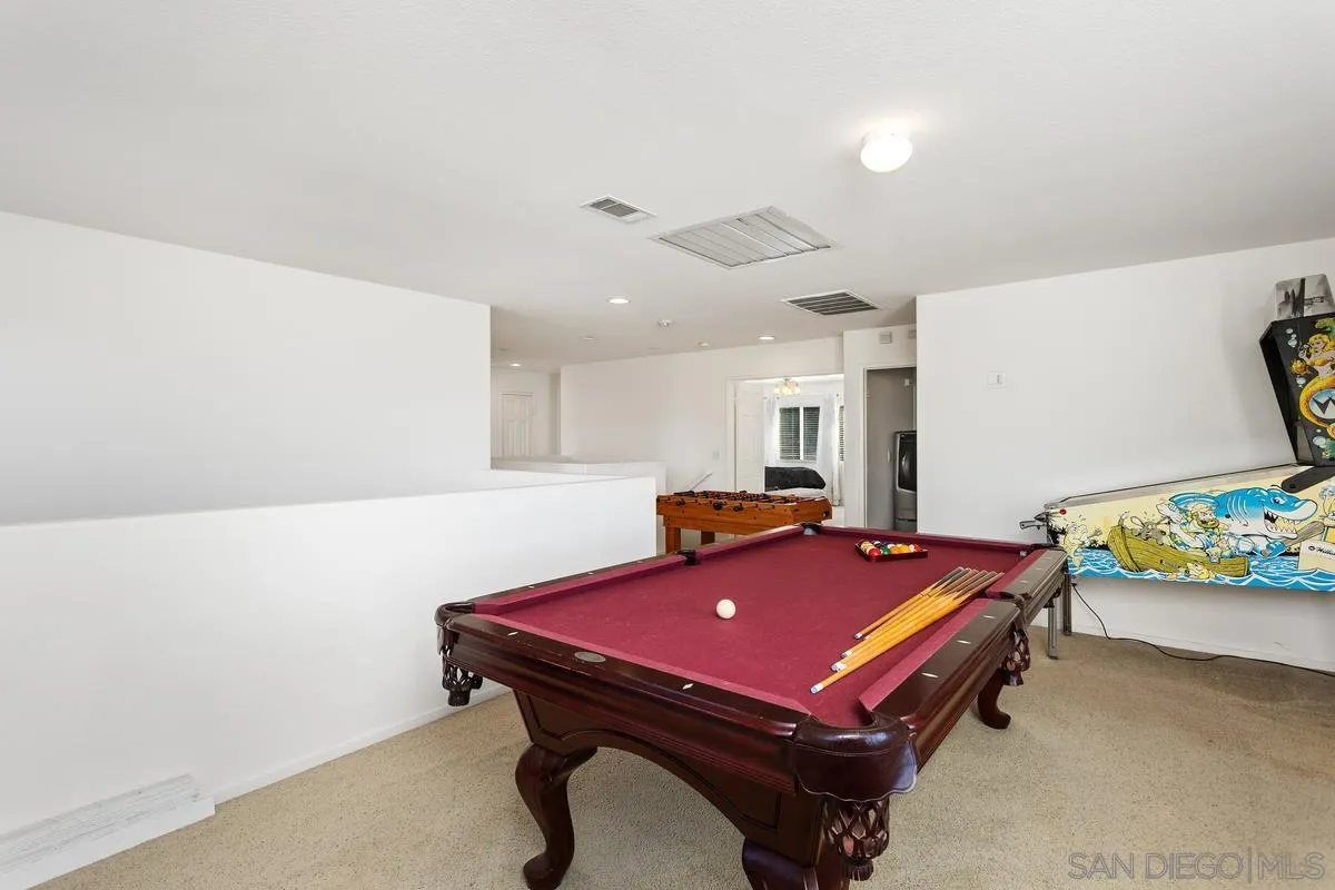 5145 Mendip Street Oceanside, CA 92057 - Photo 16 of 33 a room with furniture pool table and a projector screen