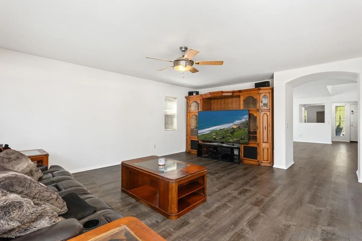 5145 Mendip Street Oceanside, CA 92057 - Photo 8 of 33 a living room with furniture and a flat screen tv