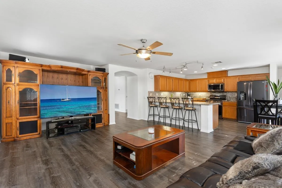 5145 Mendip Street Oceanside, CA 92057 - Photo 10 of 33 a living room with furniture a ceiling fan and a rug
