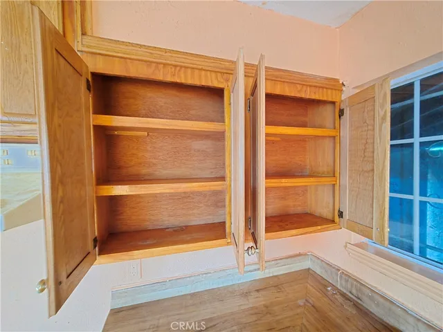 a view of storage and utility room with closet