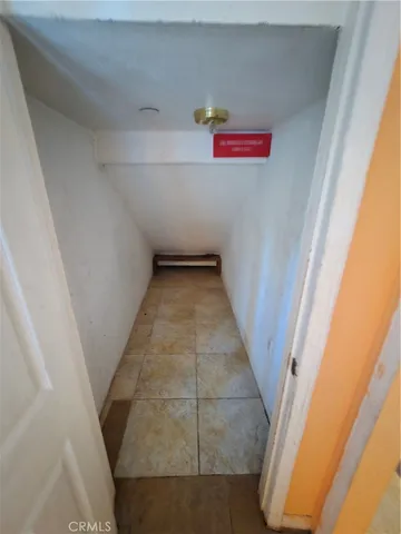 a kitchen with granite countertop white cabinets and sink