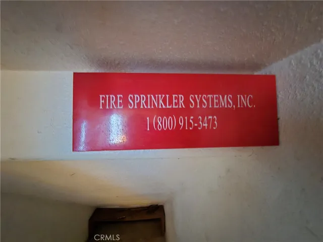 a view of an empty room and wooden floor