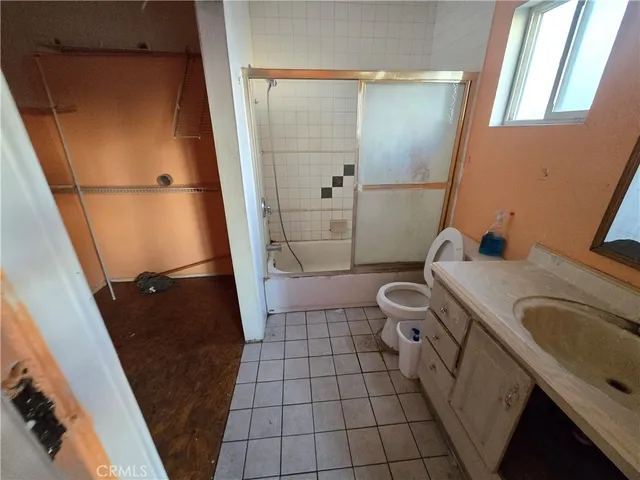 a bathroom with a sink and toilet