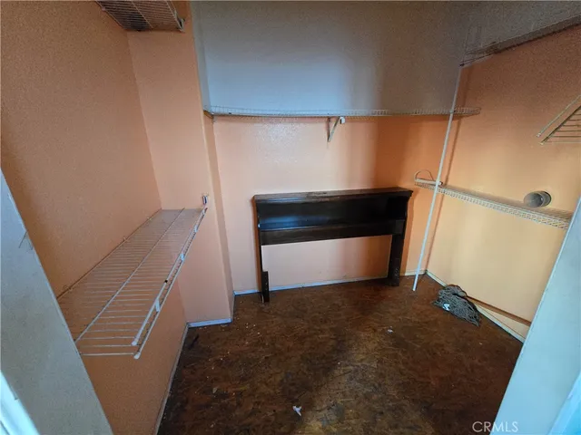 a bathroom with a sink a toilet a mirror and shower