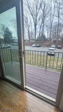 a view of wooden balcony with a bench