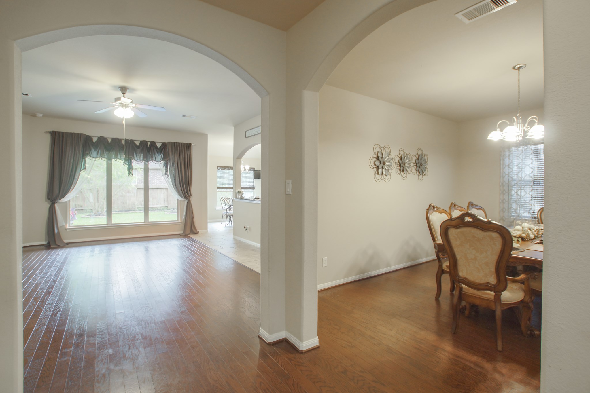 111 Pheasant Run Drive Conroe, TX 77384 - Photo 18 of 50 a view of a room with furniture and wooden floor