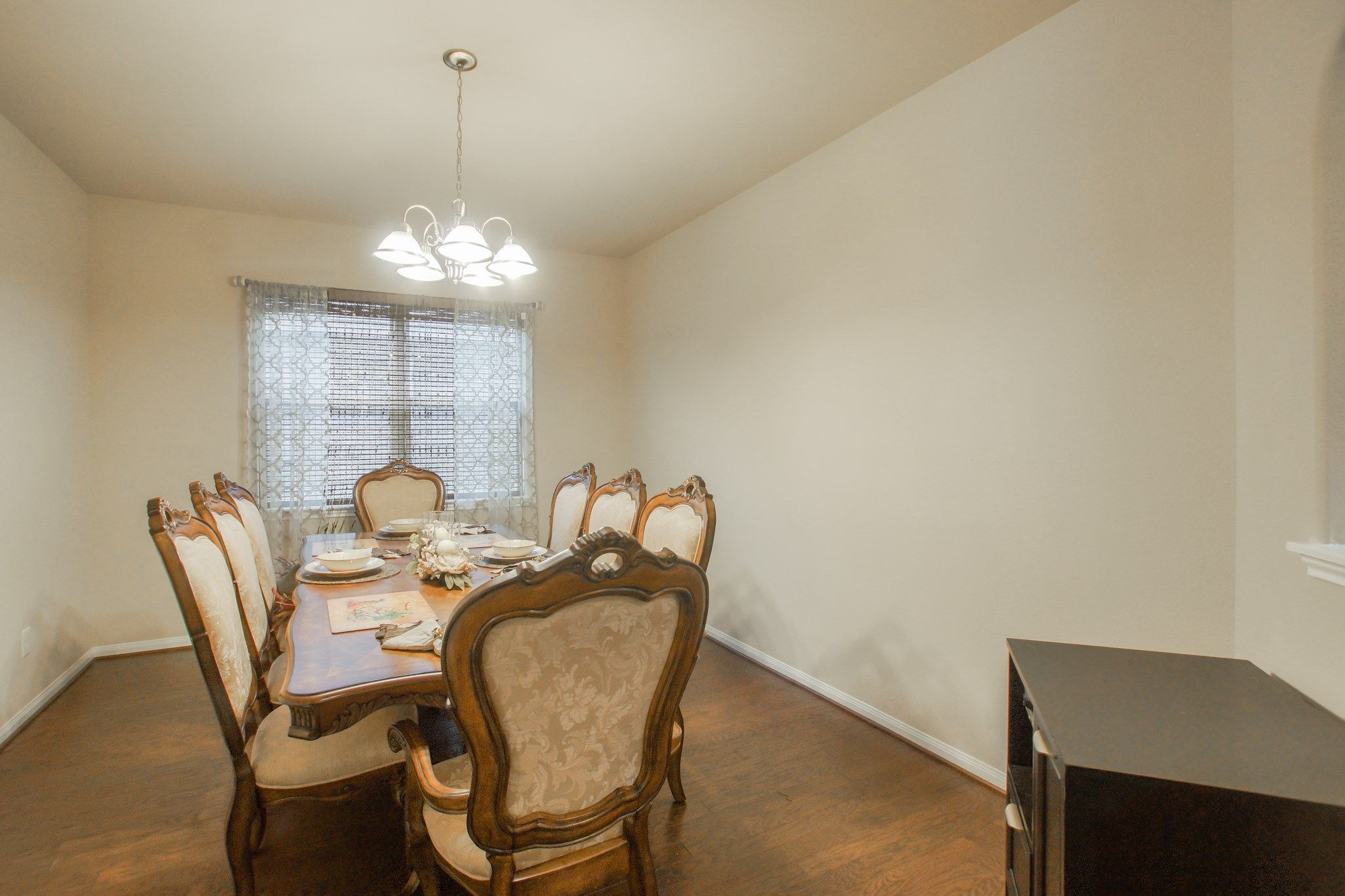 111 Pheasant Run Drive Conroe, TX 77384 - Photo 26 of 50 a view of a dining room with furniture and chandelier