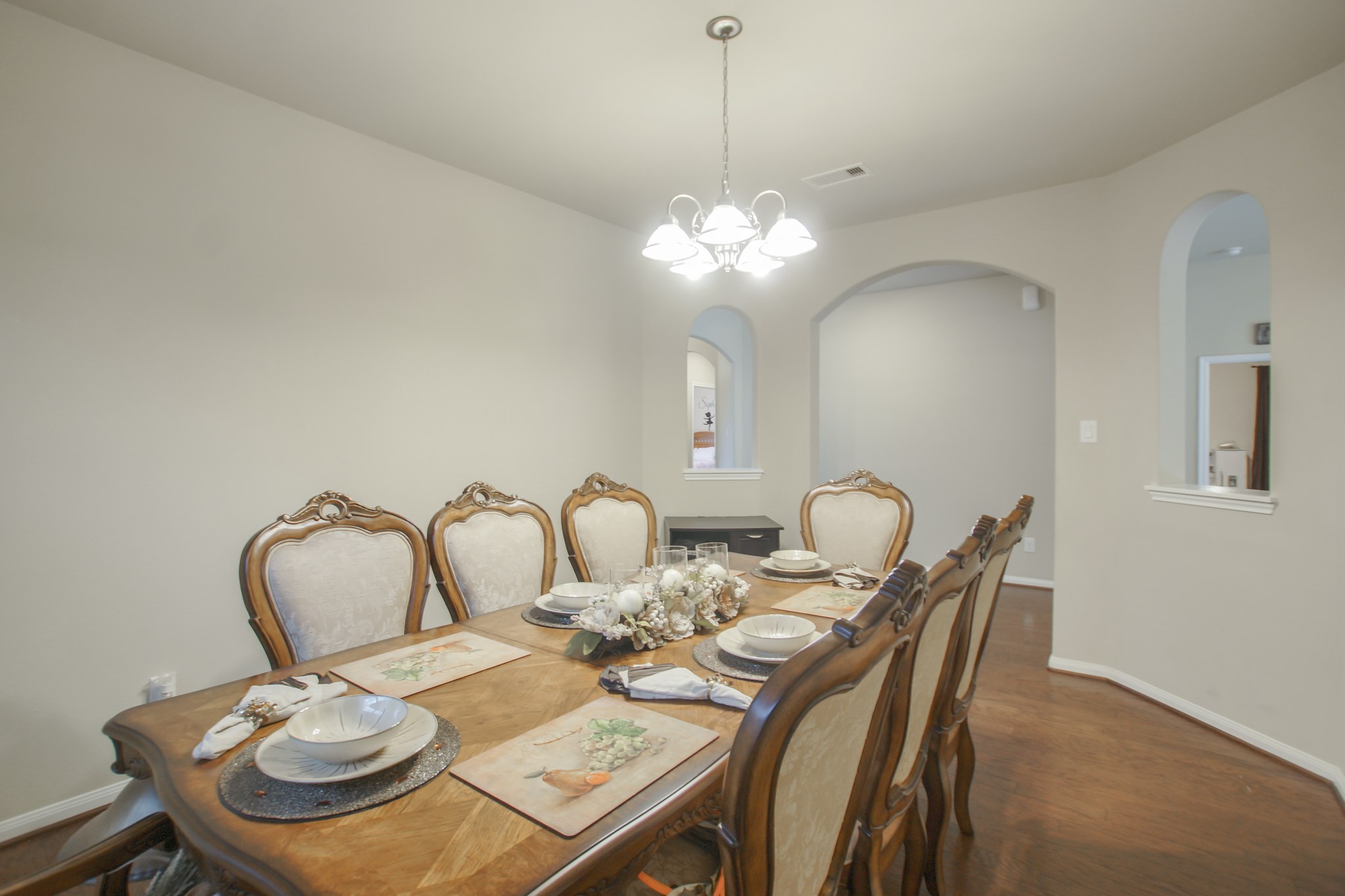 111 Pheasant Run Drive Conroe, TX 77384 - Photo 27 of 50 a dining room with furniture and a chandelier