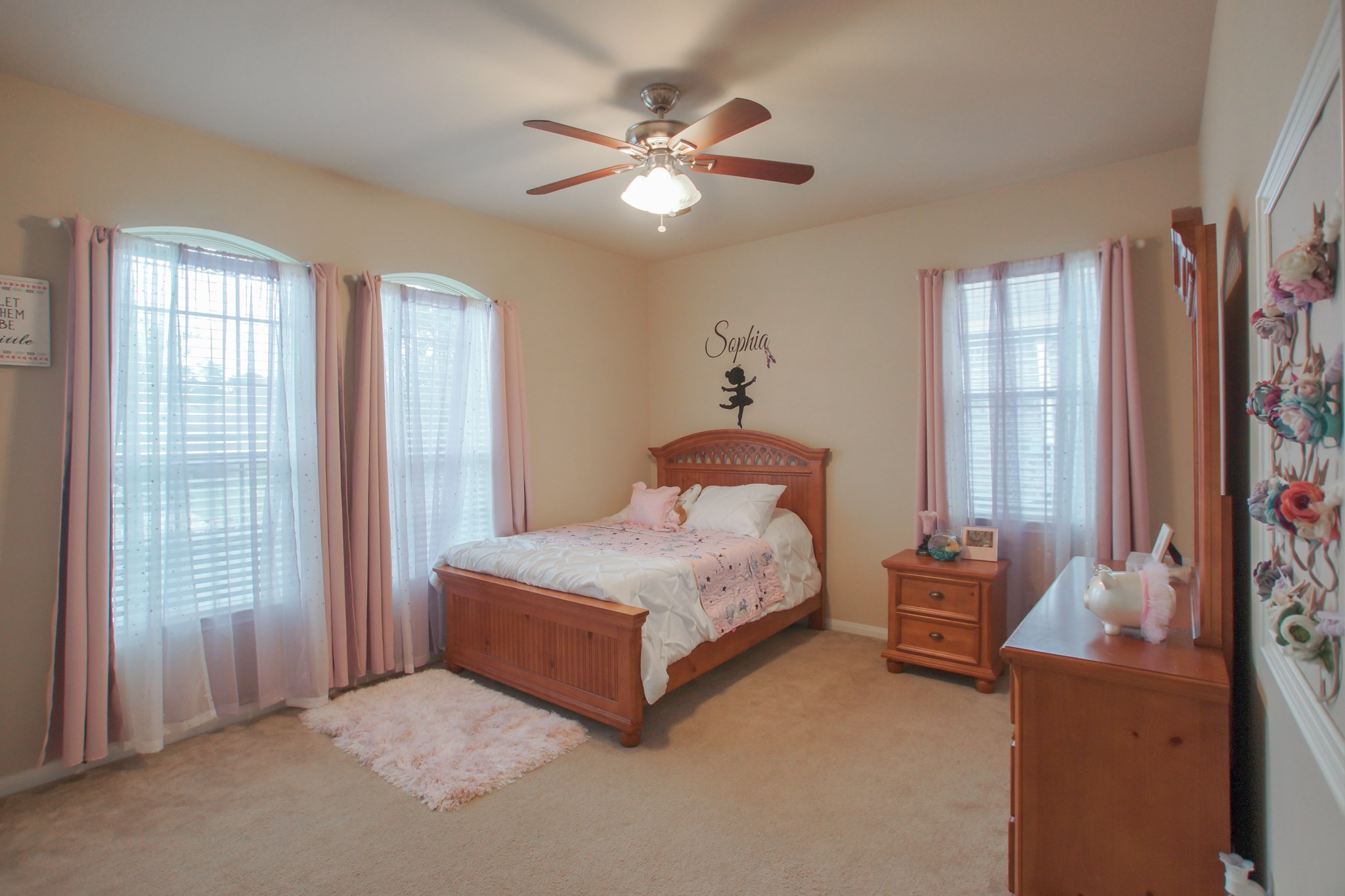 111 Pheasant Run Drive Conroe, TX 77384 - Photo 36 of 50 a bedroom with a bed and a large window