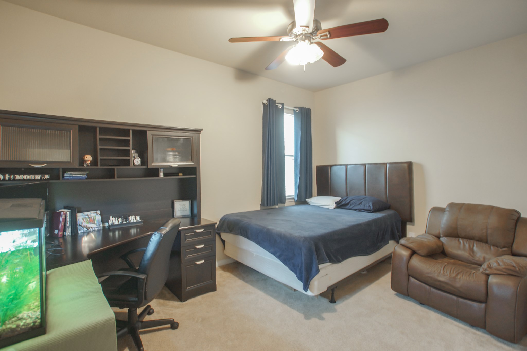 111 Pheasant Run Drive Conroe, TX 77384 - Photo 39 of 50 a spacious bedroom with a bed and furniture