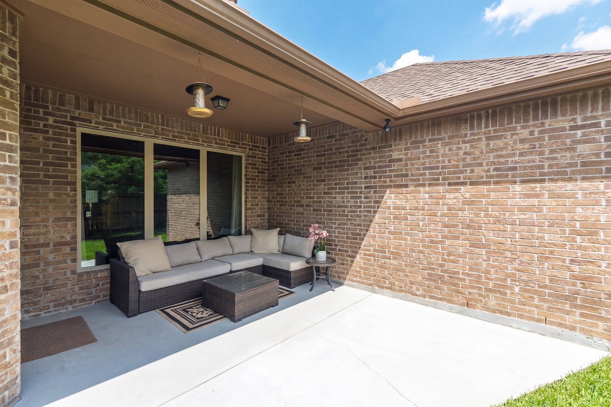 111 Pheasant Run Drive Conroe, TX 77384 - Photo 40 of 50 Transition seamlessly from indoor living to outdoor enjoyment with easy access to the covered patio from the main living areas.