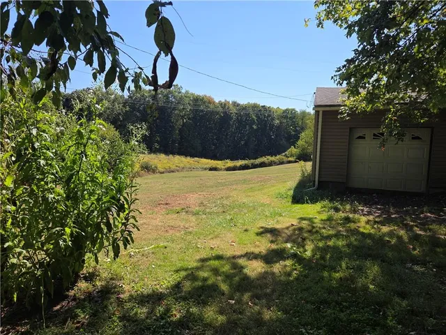 a backyard of a house with lots of green space