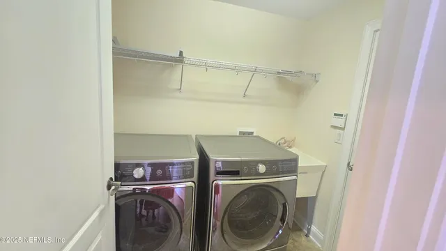 a utility room with dryer and washer