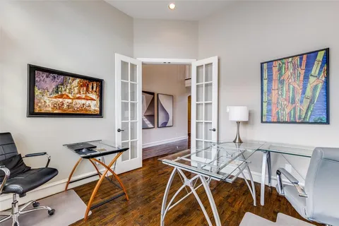 a view of a livingroom with furniture and a workspace
