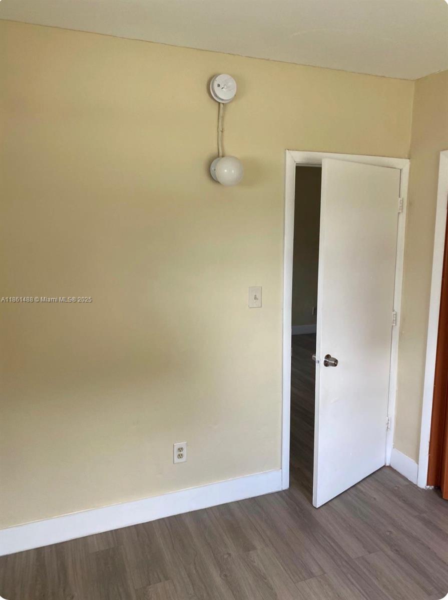 1111 Southwest 2nd Street, Unit 1111 Homestead, FL 33030 - Photo 12 of 15 a view of a room with wooden floor