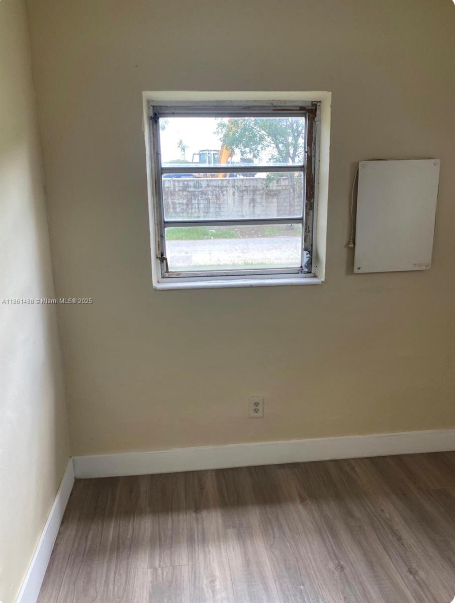 1111 Southwest 2nd Street, Unit 1111 Homestead, FL 33030 - Photo 15 of 15 an empty room with a window