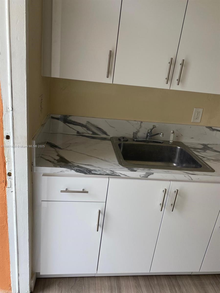 1111 Southwest 2nd Street, Unit 1111 Homestead, FL 33030 - Photo 3 of 15 a close view of utility and stove