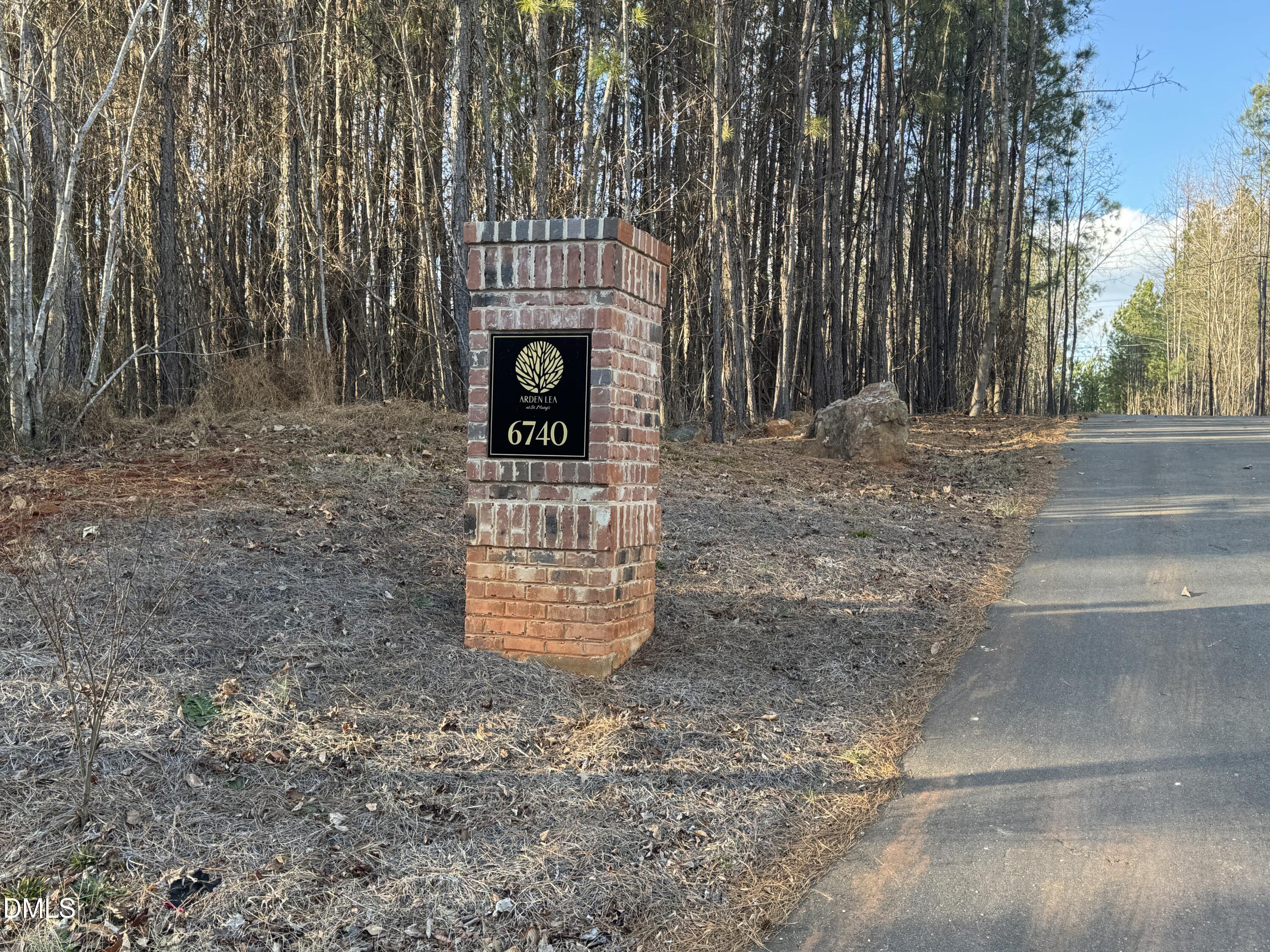 6740 St Marys Road Hillsborough, NC 27278 - Photo 4 of 26 a table and chairs in a backyard of the house