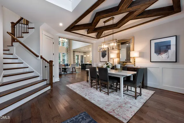 a living room with furniture a fireplace and a floor to ceiling window