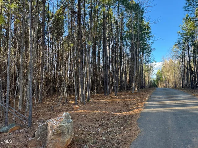 a table and chairs in a backyard of the house