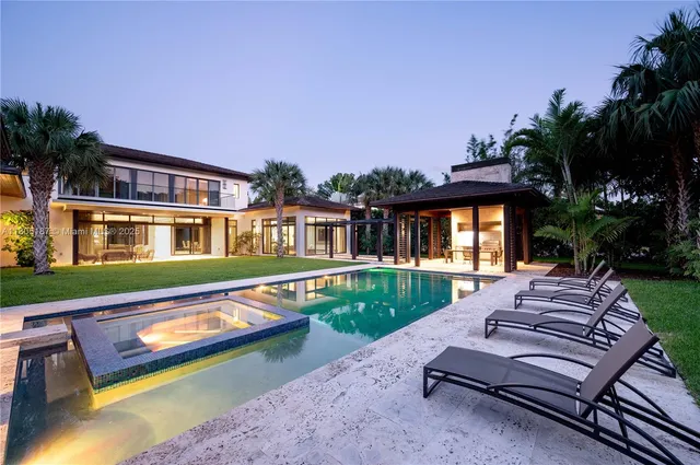 a front view of a house with a yard table and chairs