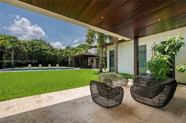 a view of a patio with couches chairs and a table