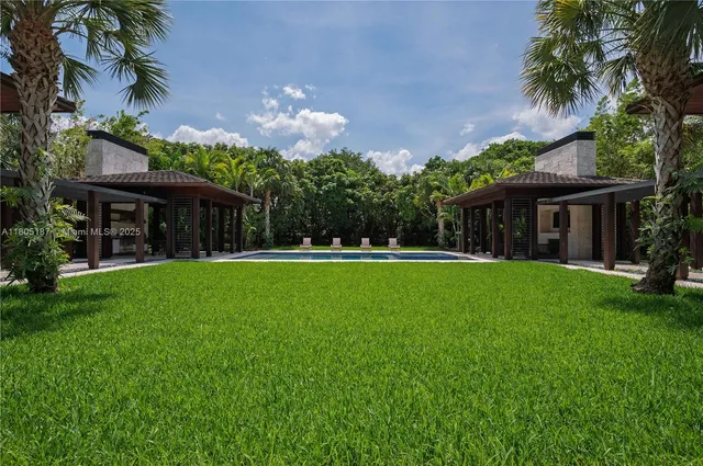 a view of house with a yard