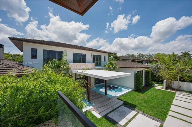 a view of a backyard with sitting area