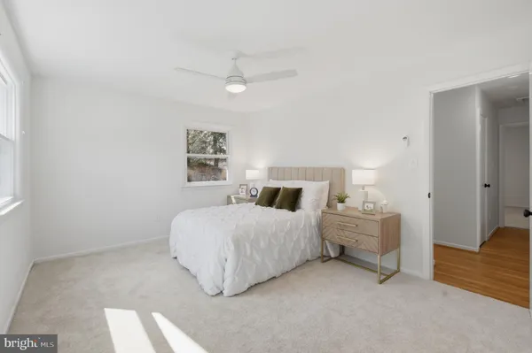 a bedroom with bed and window