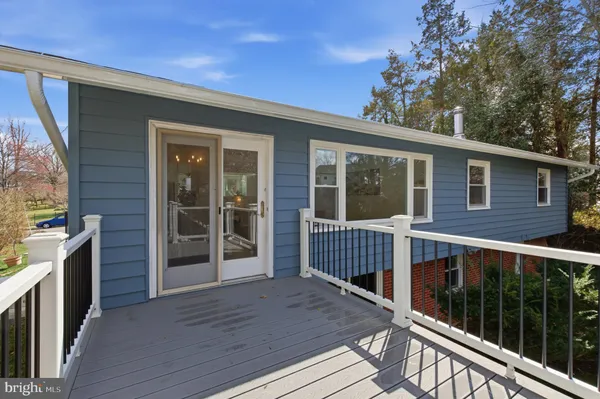 a view of balcony with deck and wooden floor