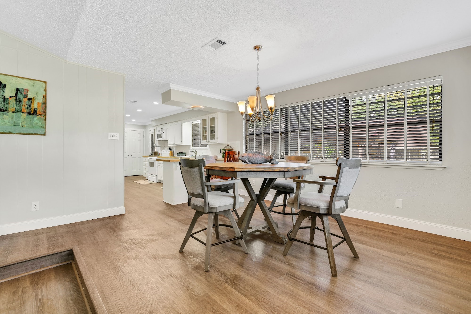 148 South Oak Bluff Street Trinity, TX 75862 - Photo 12 of 46 a view of a dining room with furniture and wooden floor