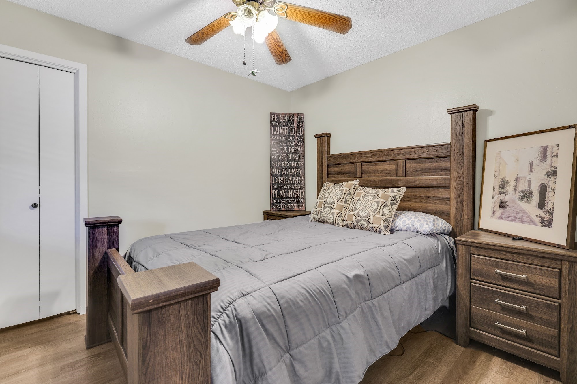 148 South Oak Bluff Street Trinity, TX 75862 - Photo 28 of 46 a bedroom with a bed and a chandelier