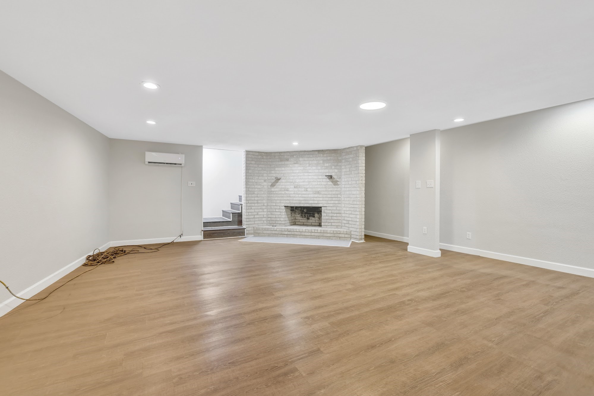 148 South Oak Bluff Street Trinity, TX 75862 - Photo 36 of 46 a view of an empty room with a fireplace and a window