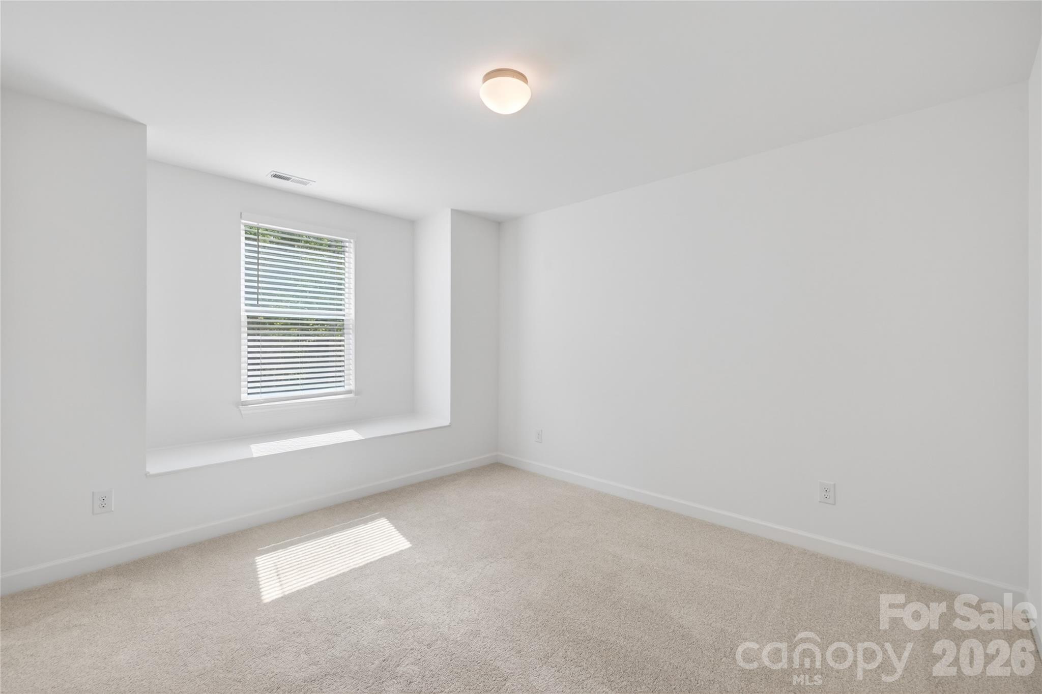 128 Overcash Road, Unit 7171 Troutman, NC 28166 - Photo 31 of 41 an empty room with windows