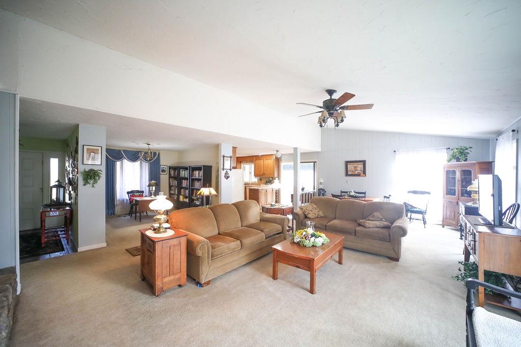 1401 Ladd Road Waynesboro, VA 22980 - Photo 13 of 53 a living room with furniture and a chandelier