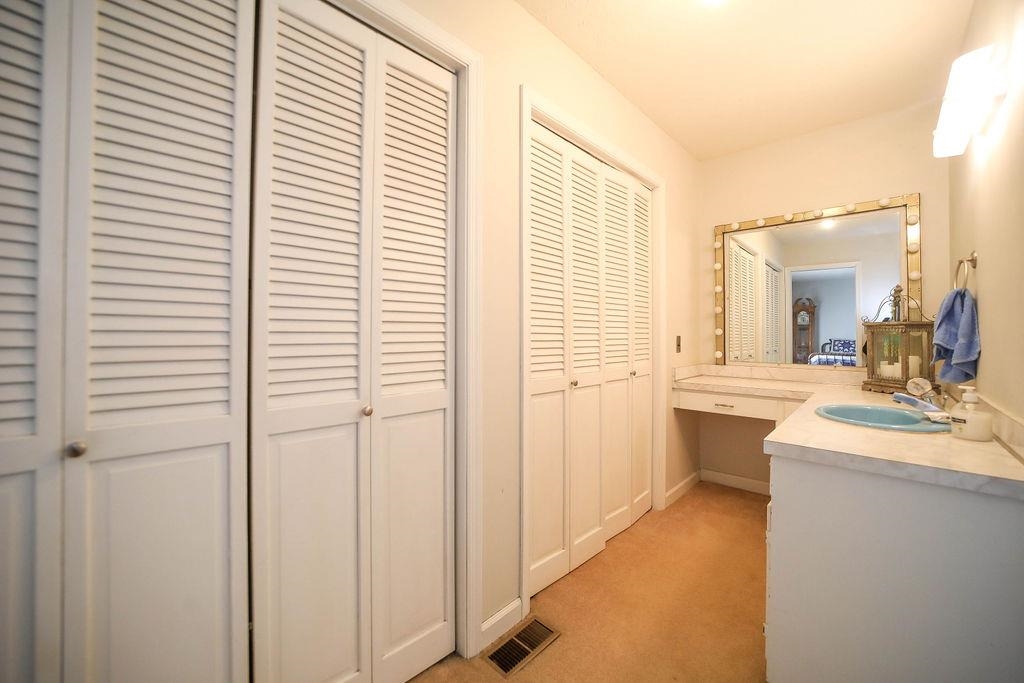 1401 Ladd Road Waynesboro, VA 22980 - Photo 35 of 53 a bathroom with a sink a mirror and a shower