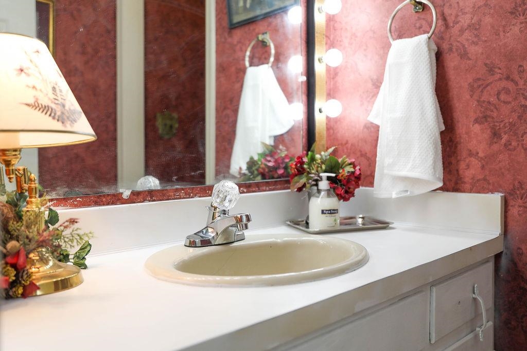 1401 Ladd Road Waynesboro, VA 22980 - Photo 47 of 53 a bathroom with a sink and a mirror