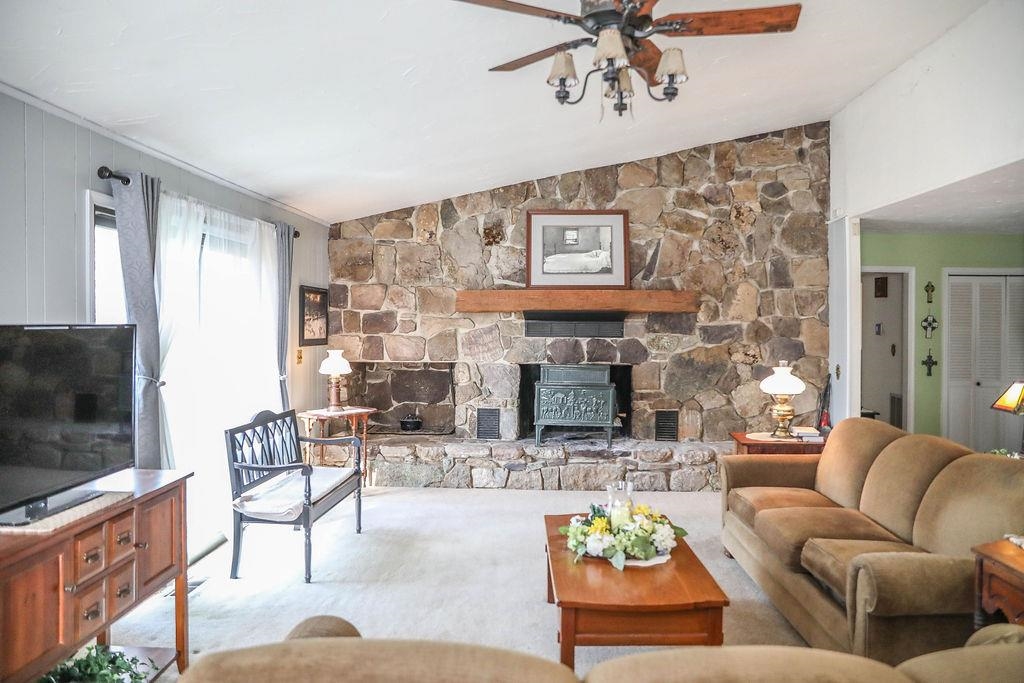 1401 Ladd Road Waynesboro, VA 22980 - Photo 5 of 53 a living room with furniture a flat screen tv and a fireplace