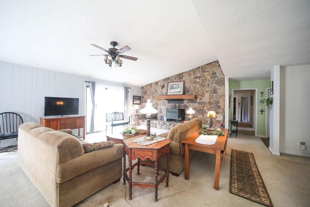 1401 Ladd Road Waynesboro, VA 22980 - Photo 10 of 53 a living room with furniture a fireplace and a flat screen tv