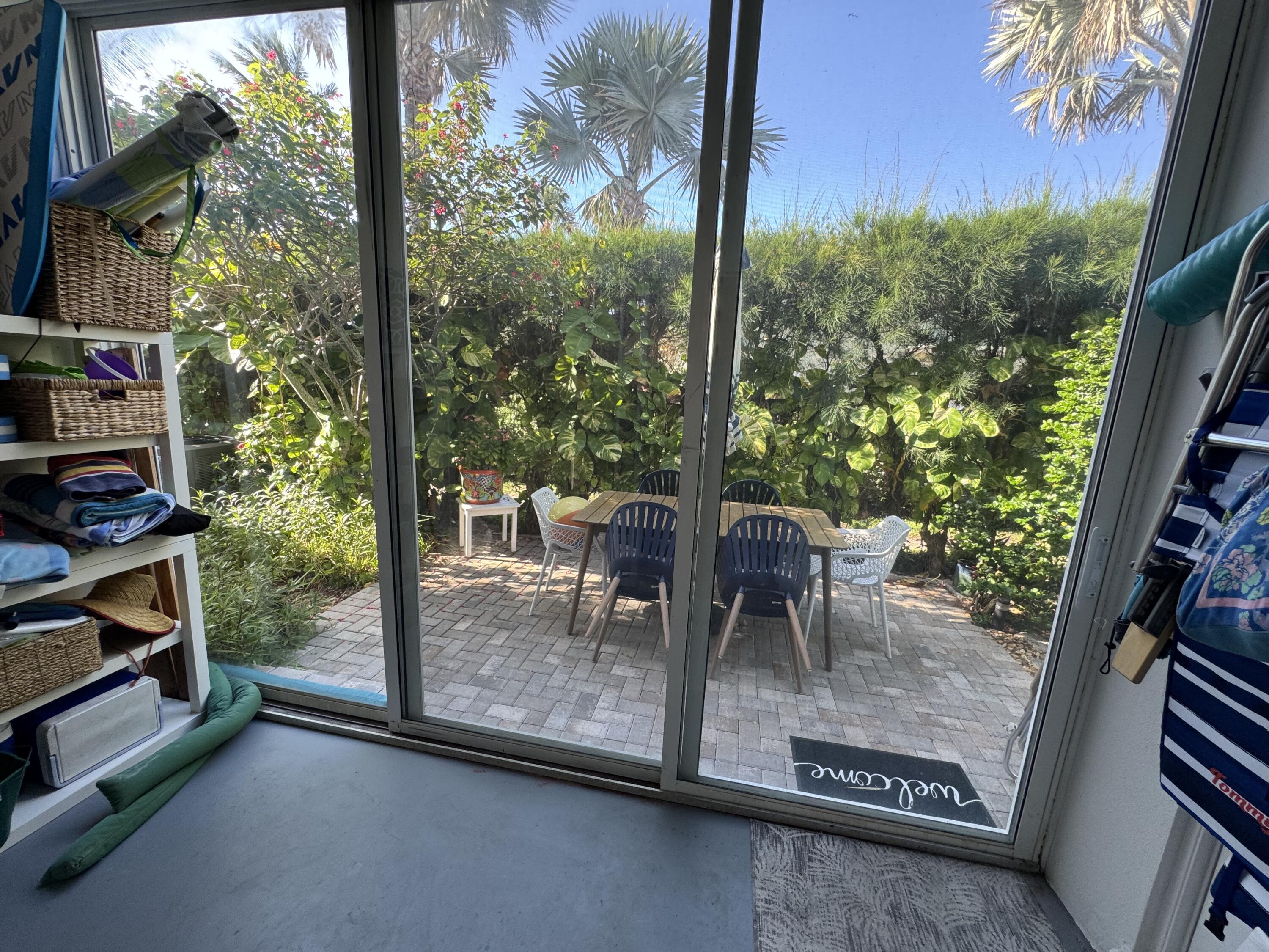5505 North Ocean Boulevard, Unit 12103 Ocean Ridge, FL 33435 - Photo 16 of 28 a dining room with furniture and a floor to ceiling window