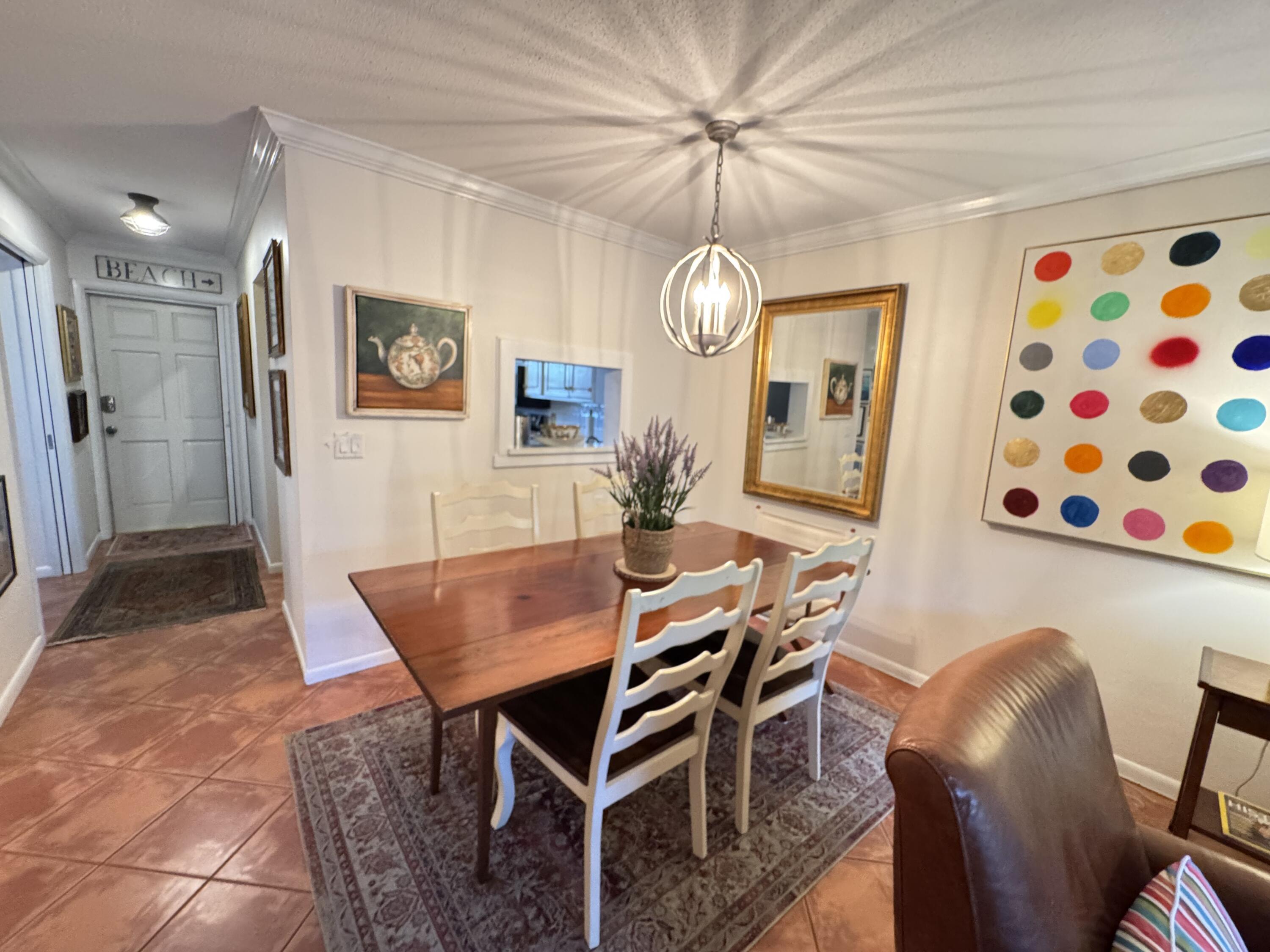 5505 North Ocean Boulevard, Unit 12103 Ocean Ridge, FL 33435 - Photo 21 of 28 a view of a dining room with furniture